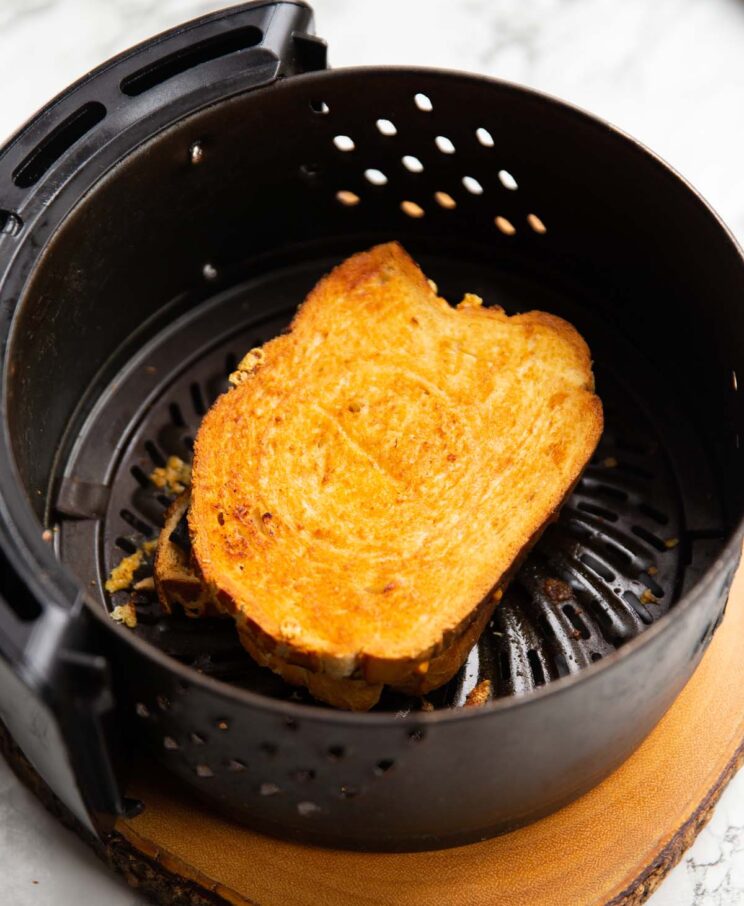 toastie in a circular black air fryer